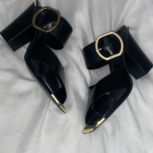 Chic Black Heels with Gold Accents